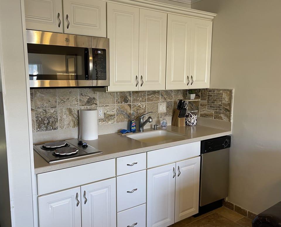 Kitchenette with microwave, stove, dishwasher, garbage disposal