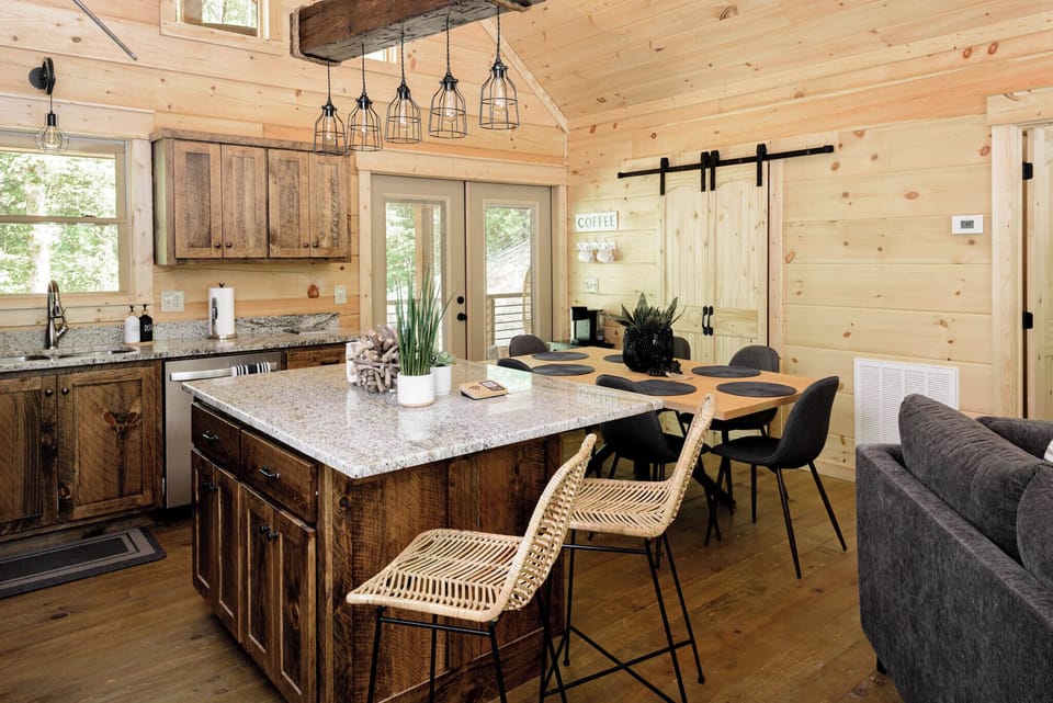 Kitchen island with granite counter top and bar chairs
