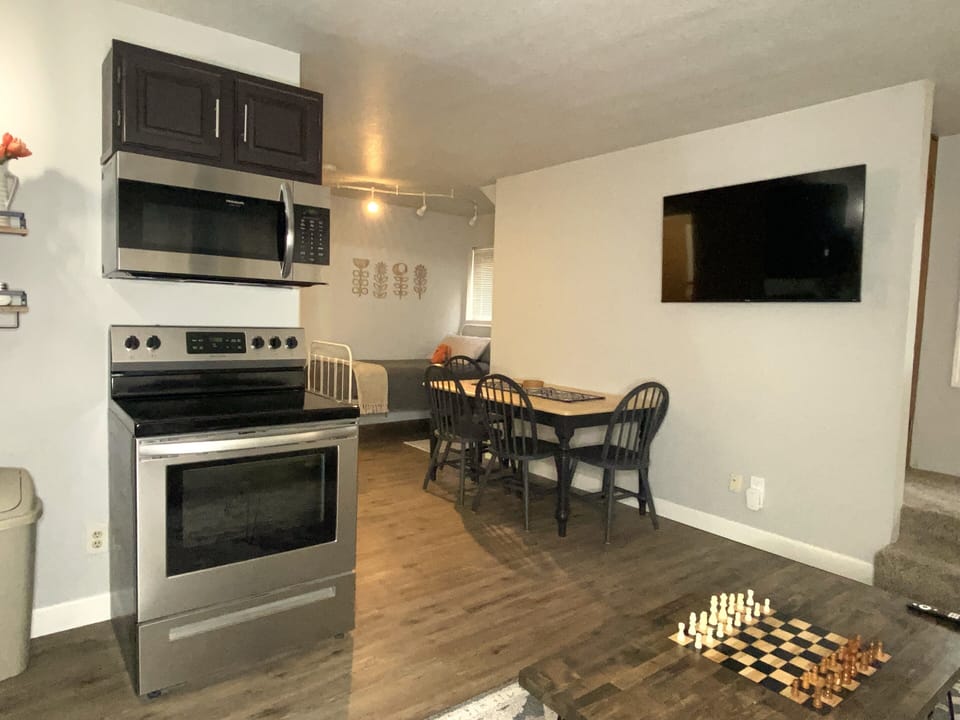 Kitchen and Dining area.  Seating for four at the table. HDTV swings out!