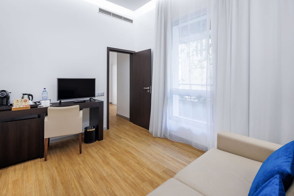 Family Suite, 1 Bedroom | Living area | LED TV, pay movies