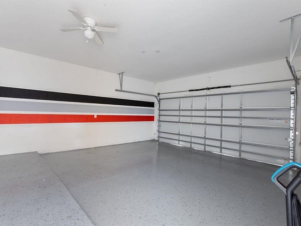 Clean, spacious garage offering plenty of room for parking & storage.