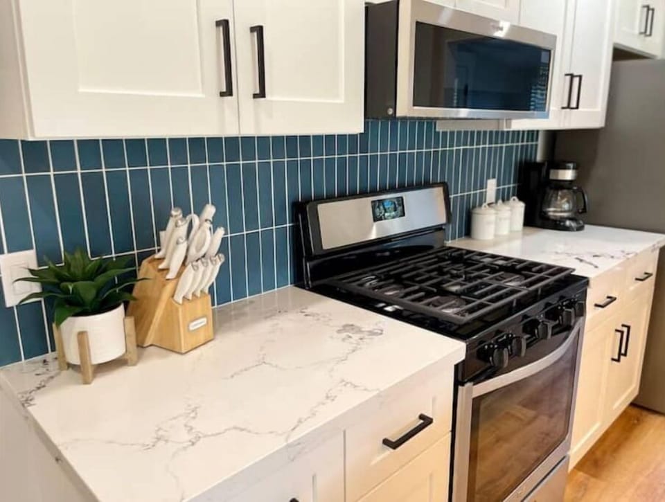 Microwave and gas range. Coffee, tea, sugar provided.