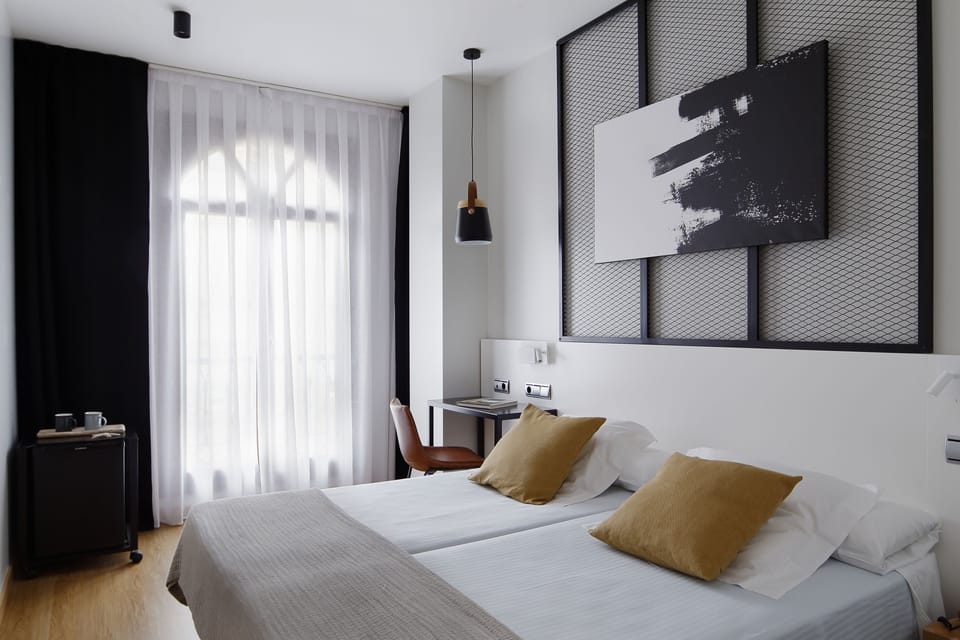 Double Room | Minibar, in-room safe, desk, blackout drapes