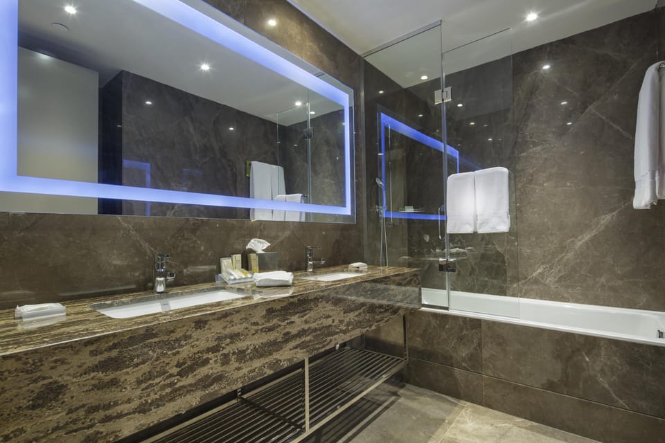 Suite, 1 Bedroom | Bathroom | Combined shower/tub, hair dryer, bathrobes, slippers