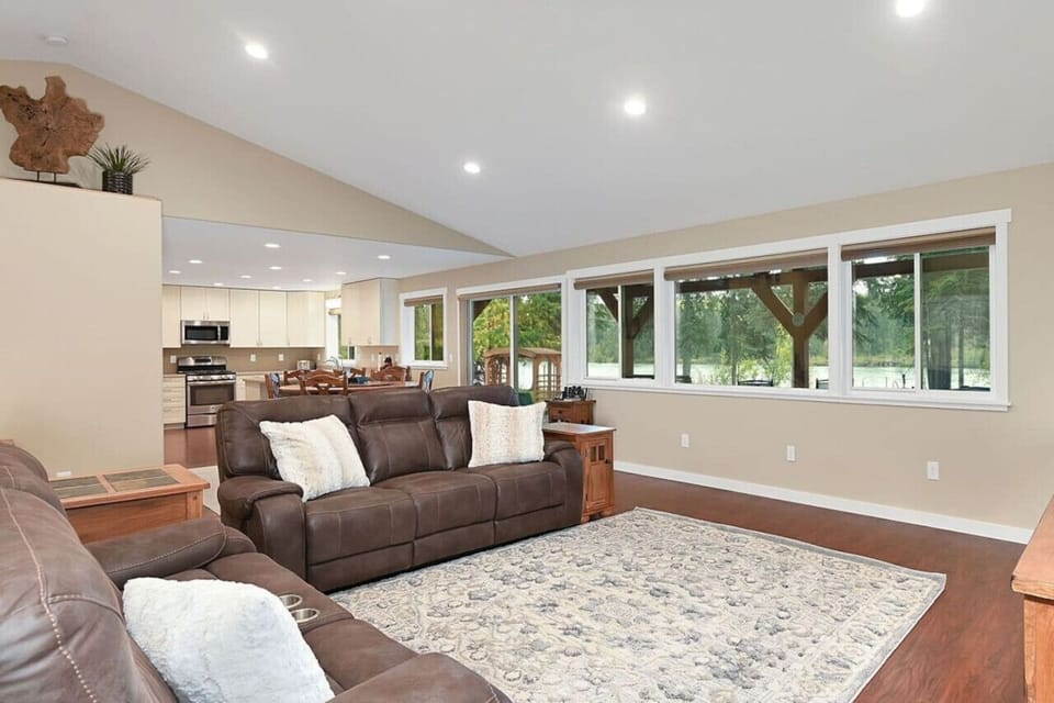Living room with seating and river views.