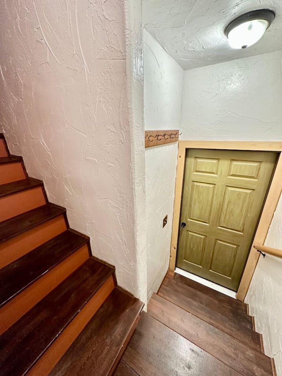 Stairs leading to ground level 3rd bedroom as well as laundry.