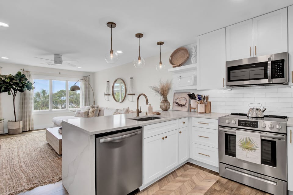 Whip up a meal in the modern chef’s kitchen with new cabinets, quartz countertops, appliances, and cookery.