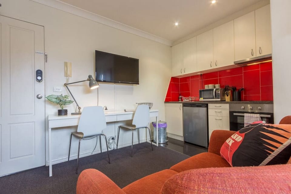 Kitchen area with desk & small couch