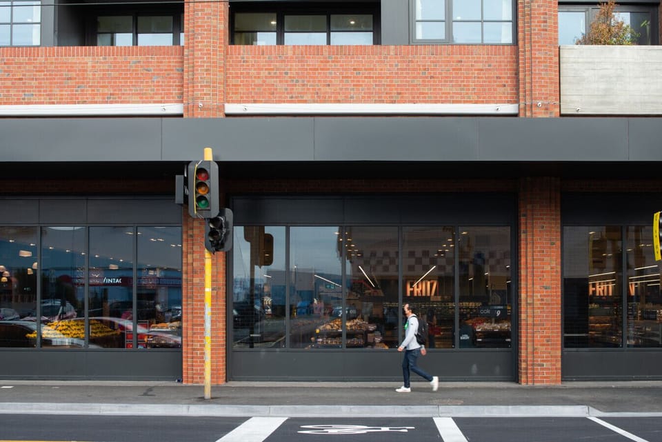 A vibrant Richmond streetscape with cafés, bakeries and everyday essentials just steps from your door