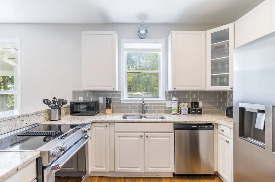 Fully stocked kitchen with stainless appliances