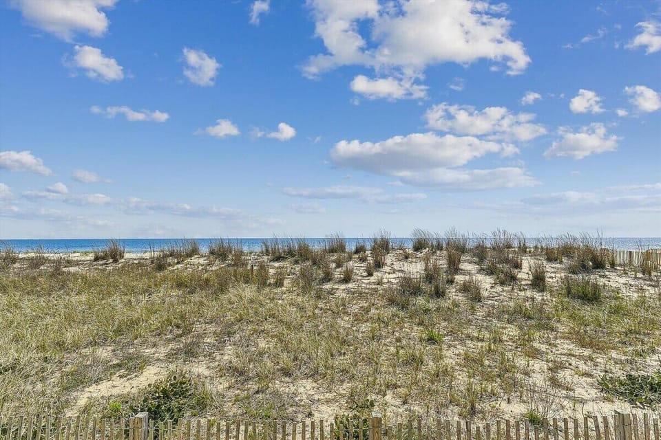 Beach access is mere steps from the front door of this unit