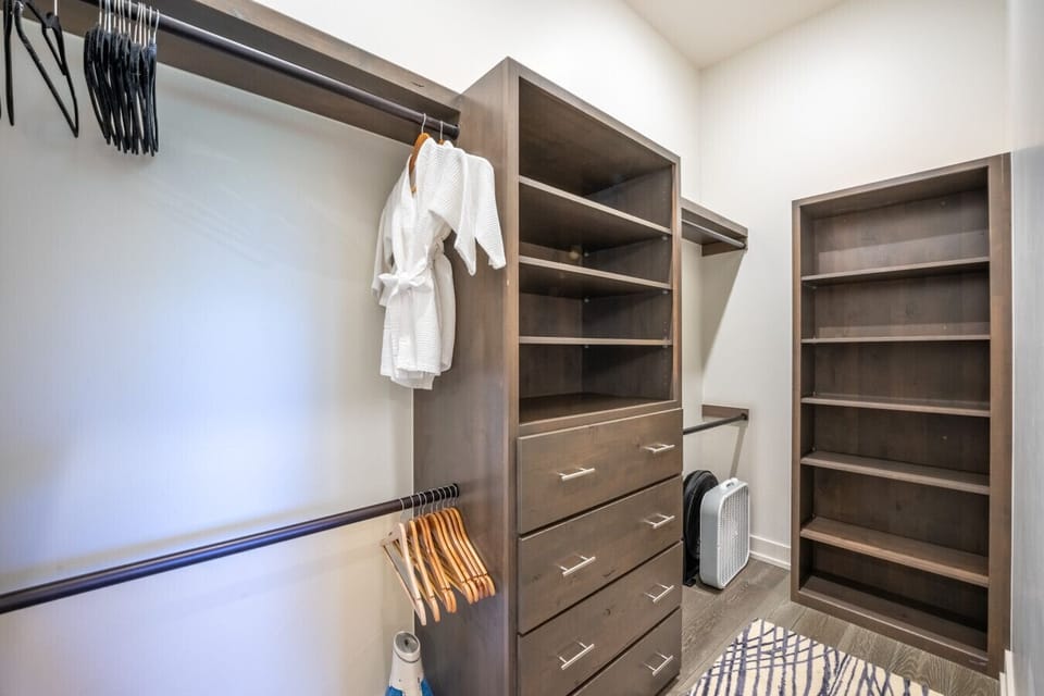 Walk in closet for the upstairs primary bedroom