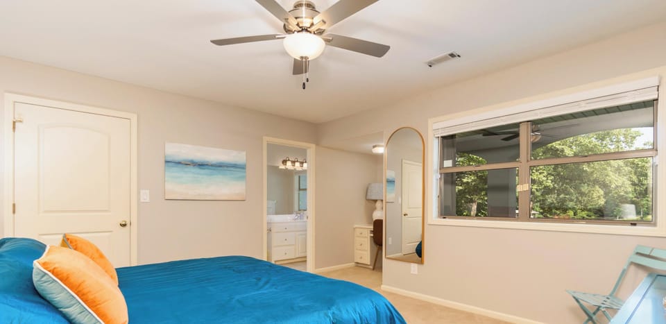 Spacious king bedroom with a private ensuite bath and plenty of natural light.