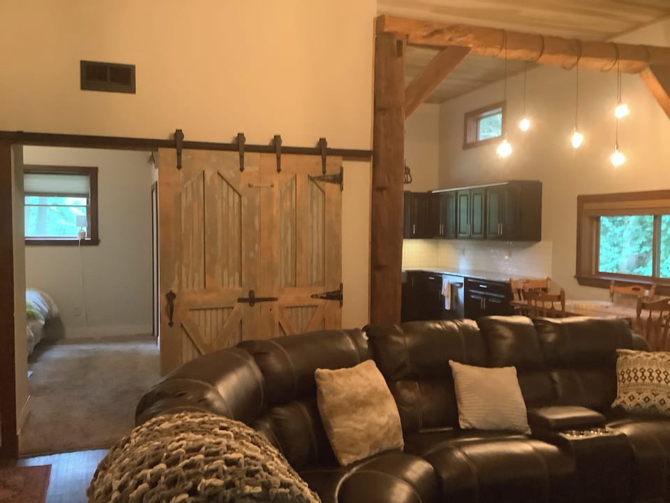 View of master bedroom and kitchen from living room. 