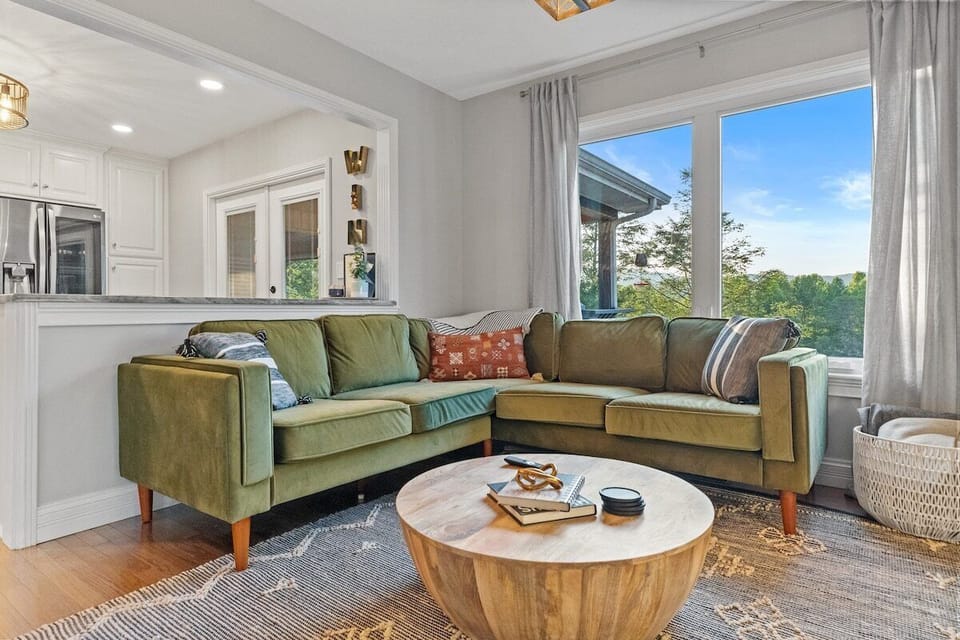 Living room with big bay window over the lake. 