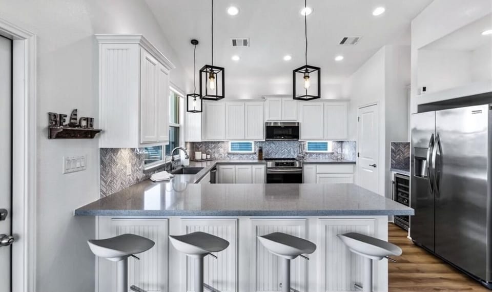The open kitchen with counter level dining.