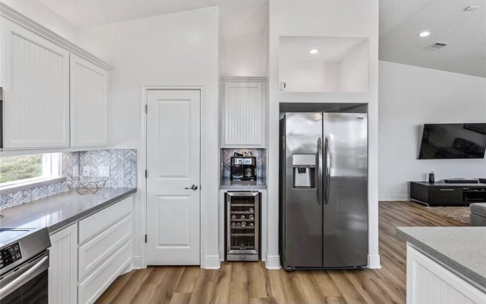 Enjoy the wine fridge and coffee station.