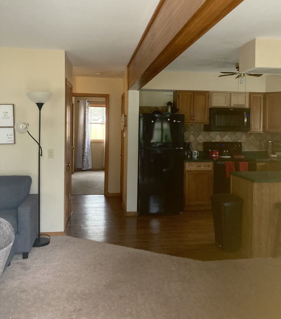 Walking in the front door opening to kitchen, dining area and living room.