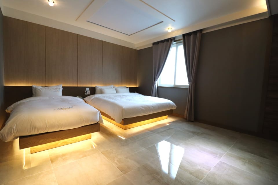 Premium Quadruple Room | Down comforters, individually decorated, individually furnished, desk