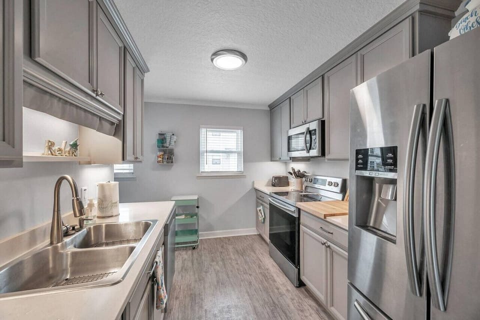 Functional kitchen w/ ample counter space, ready for simple meals and snacks.