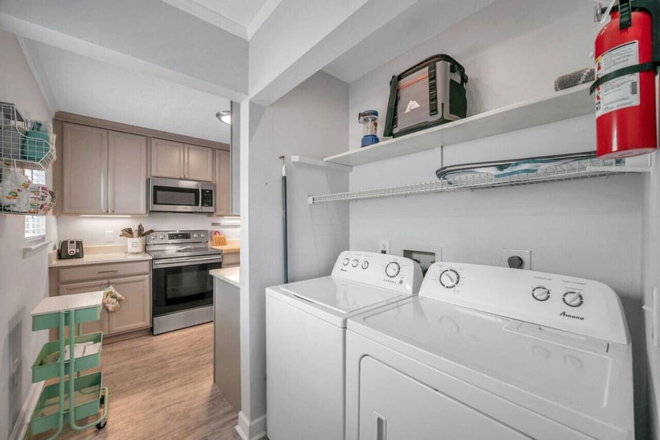 Convenient laundry area w/ washer & dryer tucked neatly into the home.