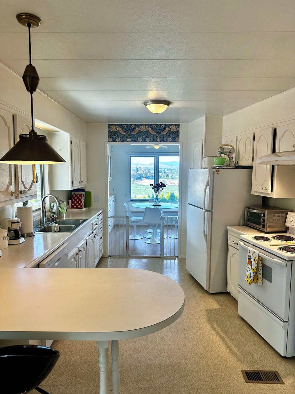 Spacious, light, long kitchen easy to work in. 