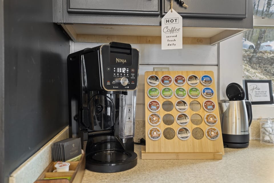 Indulge in the perfect blend of nature and caffeine at our cozy coffee bar.  Includes electric tea kettle, coffee pods, creamer and tea bags. 