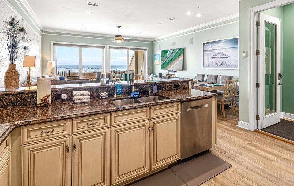 Entryway, and kitchen overlooking the living room and great view of the Gulf!