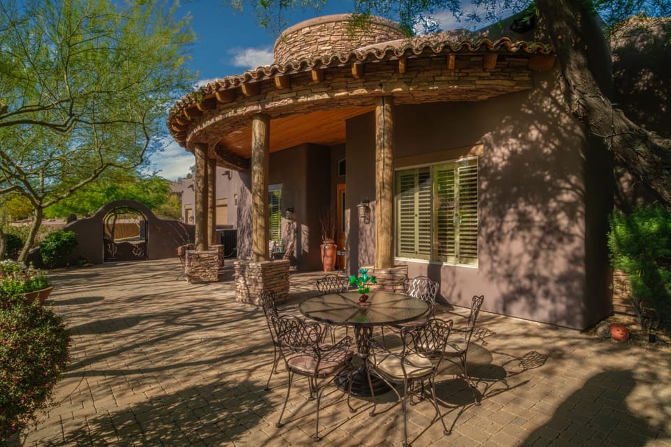 Covered patio with seating to enjoy morning coffee or a cocktail for sunsets.