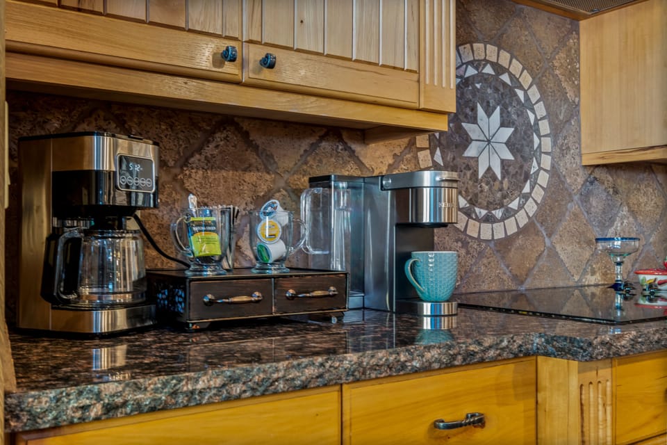 Coffee station complete with Keurig and drip coffee makers, coffee, pods and tea