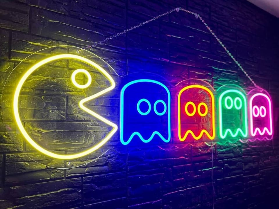 Pac-Man neon art in the game room