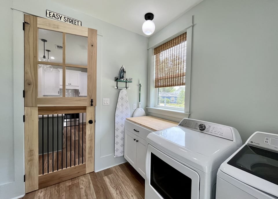 Mud Room w/ Washer & Dryer and custom-built dutch door.  Access to rear parking.