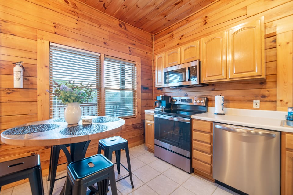 Kitchen stocked with the essentials w/ updated appliances & ample seating for 4!