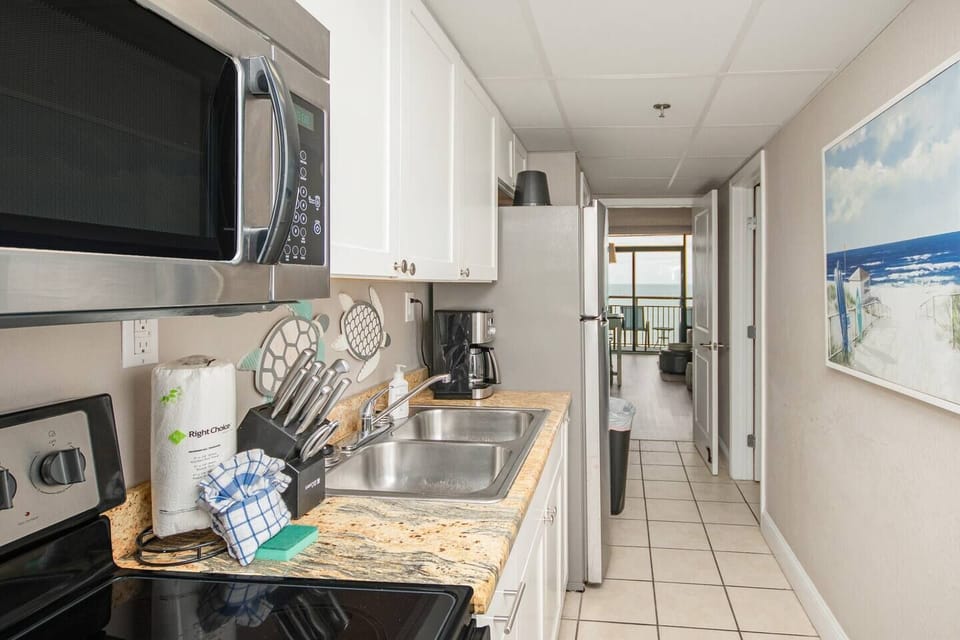 Full size stainless-steel oven, microwave, and fridge in your kitchen