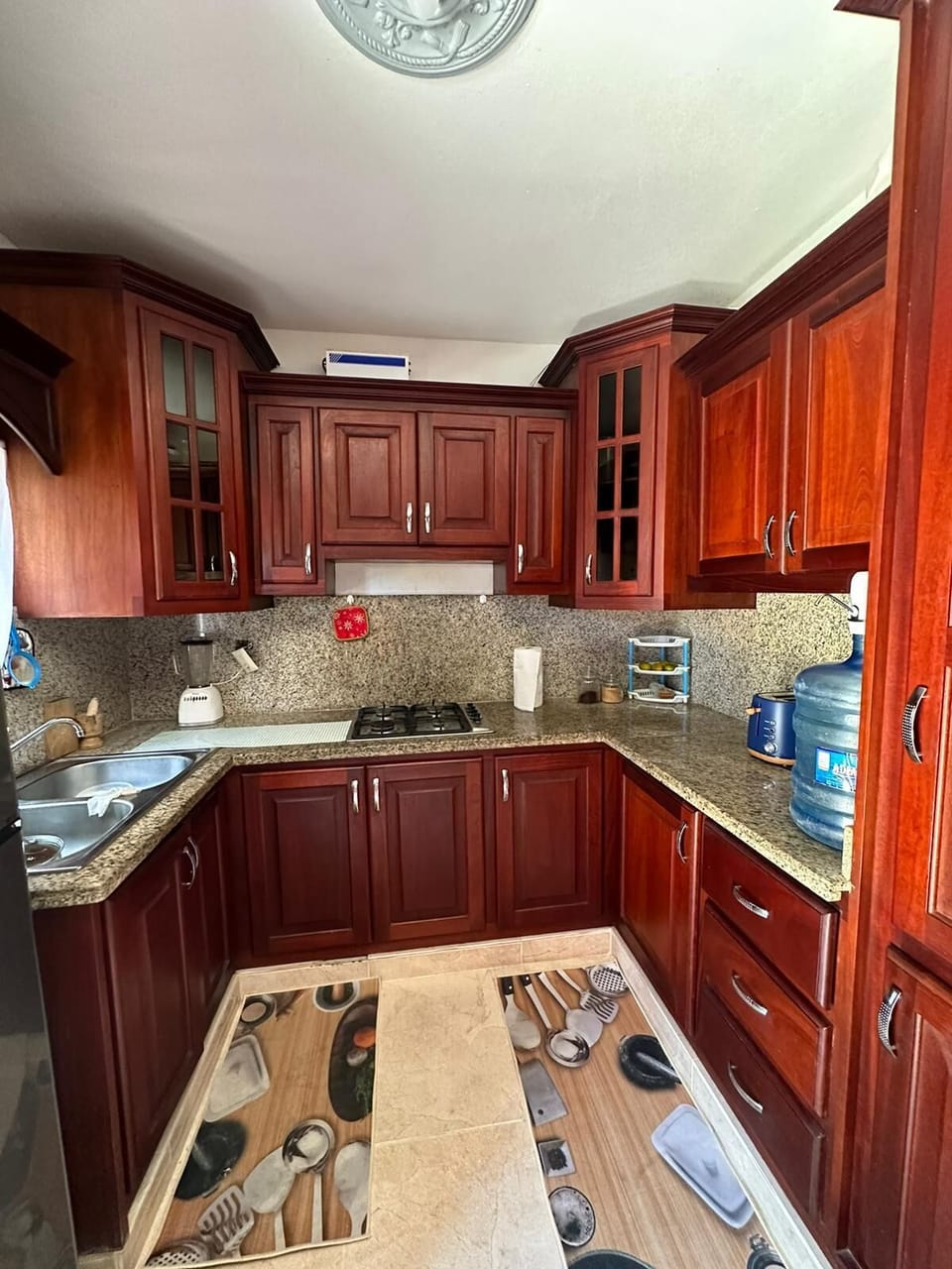 Kitchen area equipped with cooking utensils
