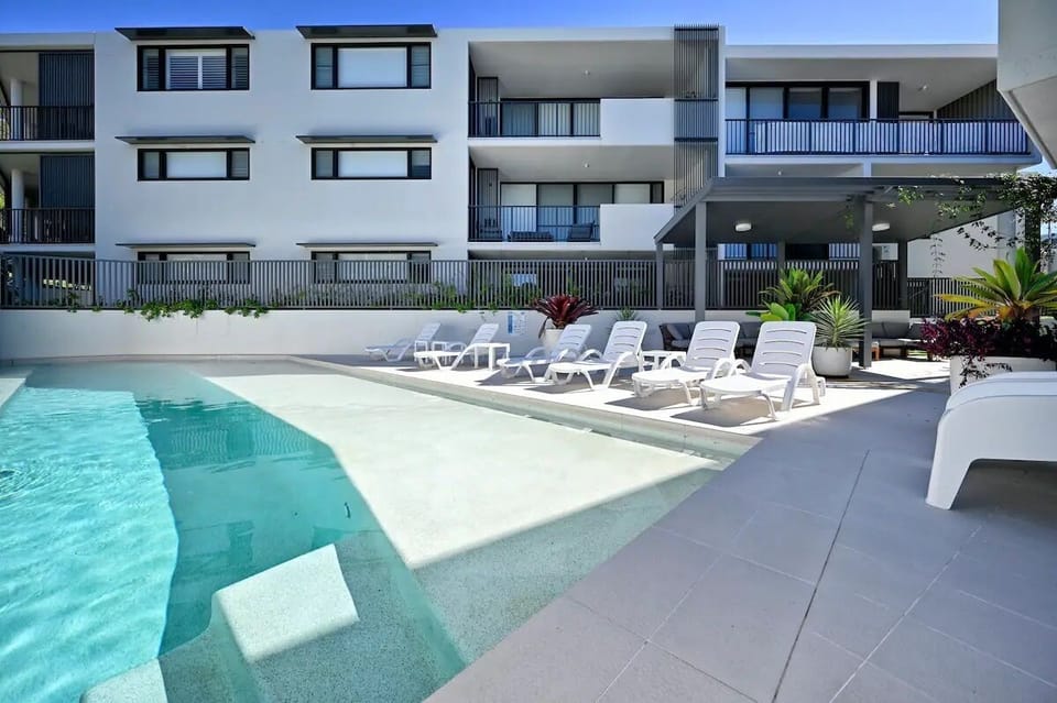 Building has pool for all residents and guests. Or walk to the end of the street and enjoy the stunning beach