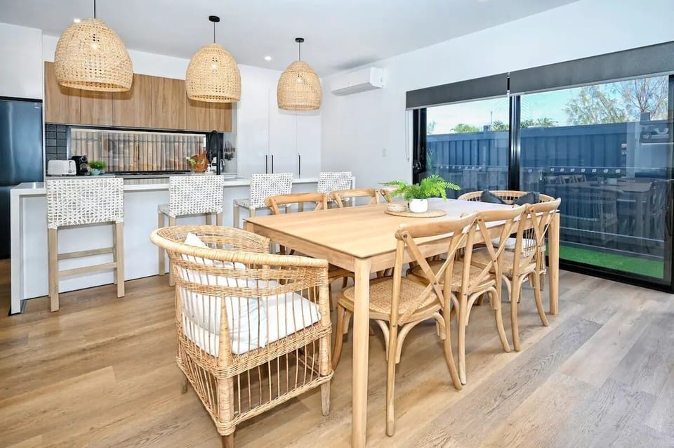 Dining table with kitchen beyond