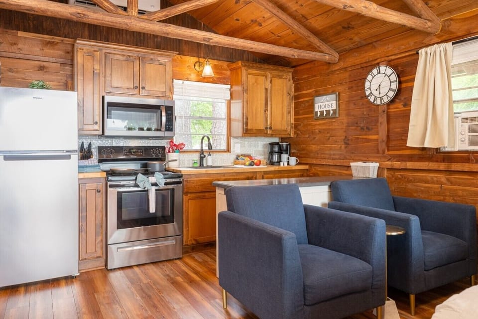 Cabin 7 View of Chairs and full kitchen with full amenities