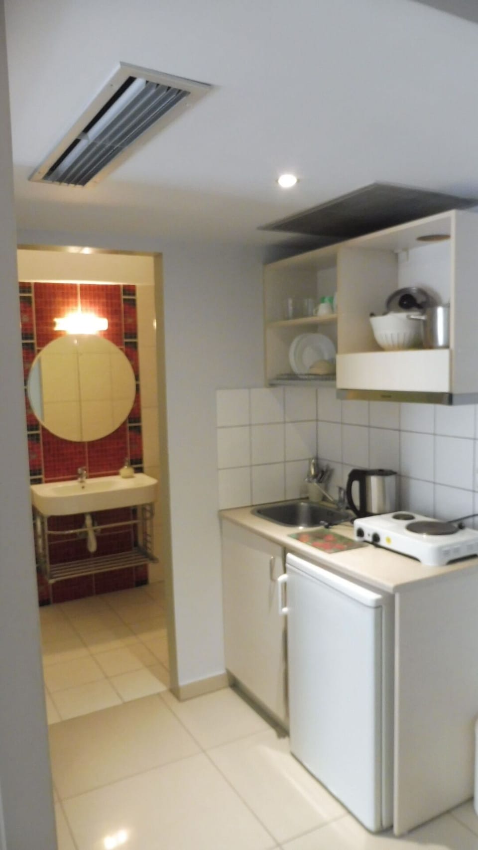 Full-size fridge, stovetop, cookware/dishes/utensils, freezer