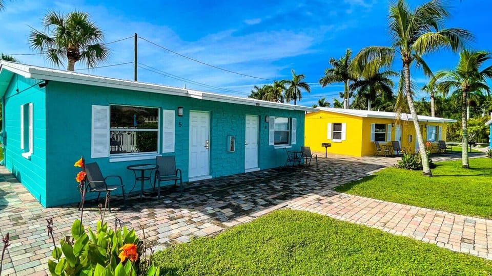 Private outdoor seating area offering a relaxing poolside cottage experience.