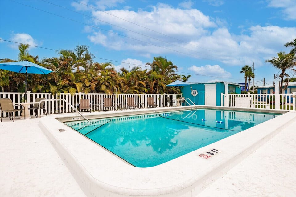 Gated outdoor pool offering a secure and relaxing leisure area.