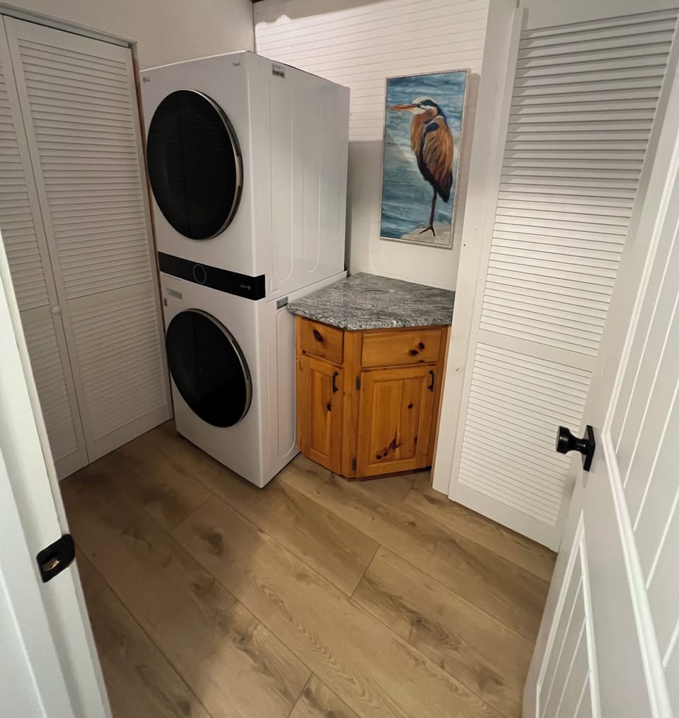 Laundry room on lower level down the hall from bedroom 3