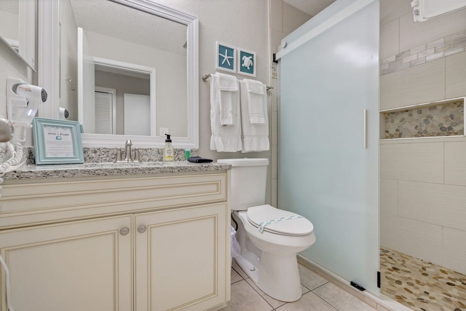Guest bathroom with walk-in tiled shower