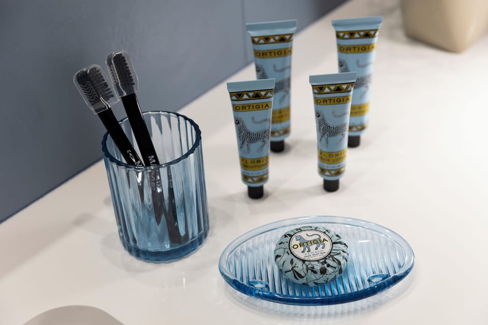 Jetted tub, rainfall showerhead, designer toiletries, hair dryer
