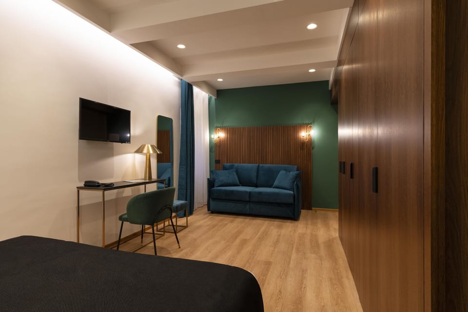 Superior Quadruple Room | In-room safe, desk, blackout drapes, soundproofing