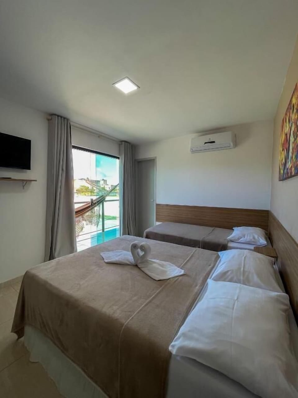 Exclusive Triple Room | Minibar, individually furnished, laptop workspace, bed sheets