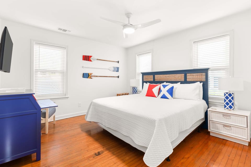 Bedroom 1 with King bed, TV and attached half bath