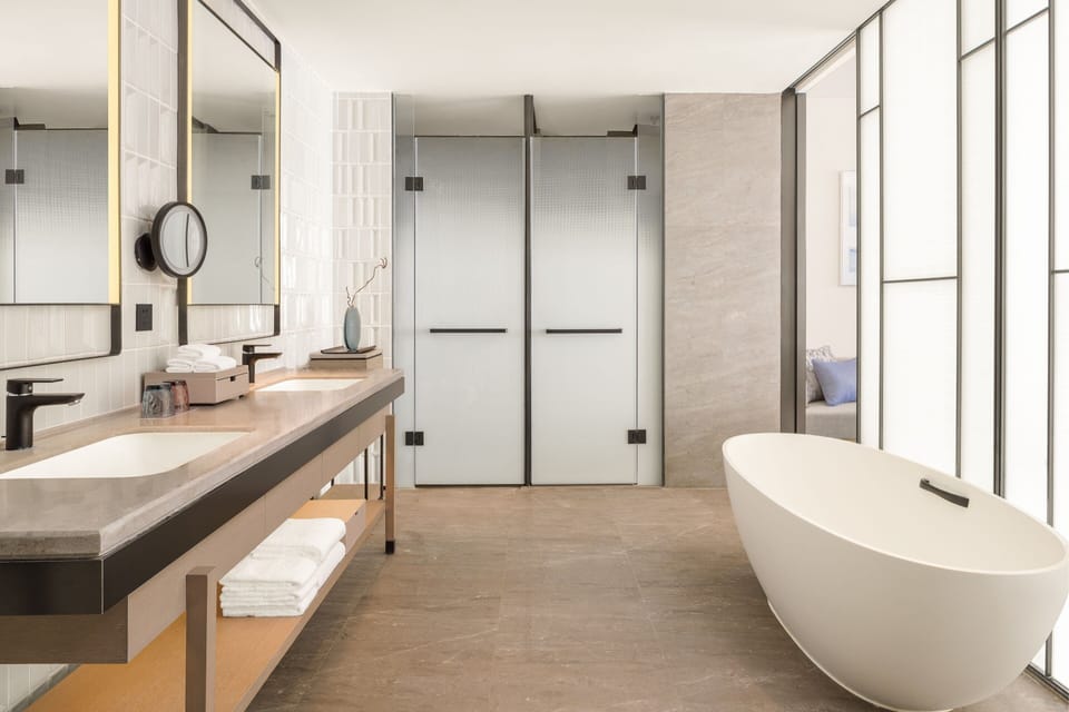 Premier Suite, 1 Bedroom, Balcony | Bathroom | Separate tub and shower, rainfall showerhead, free toiletries