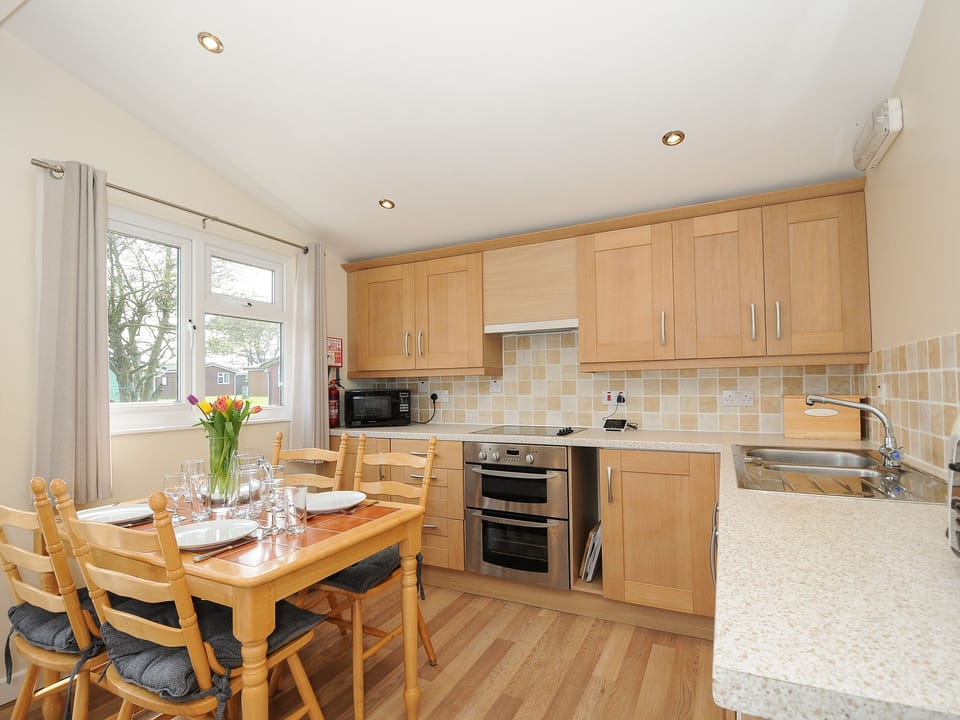 Fridge, electric kettle, cookware/dishes/utensils