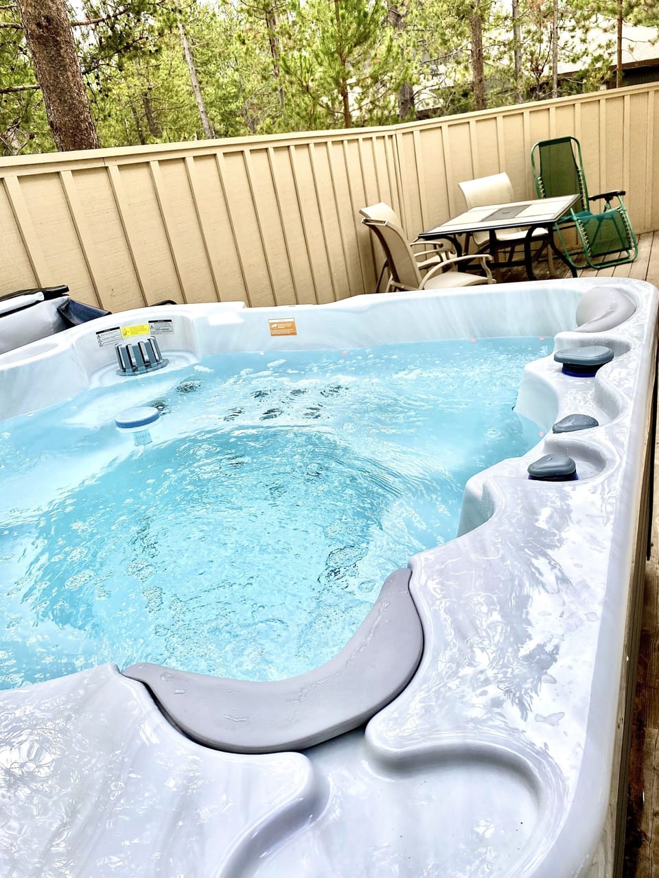 Back deck with brand new hot tub.